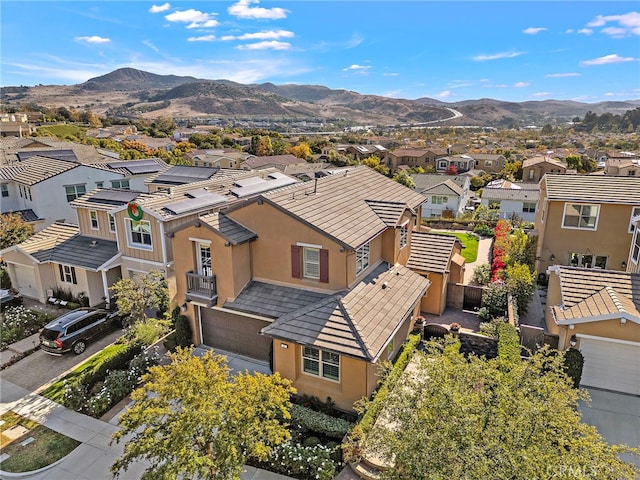 birds eye view of property featuring a mountain view