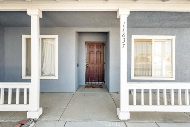 property entrance with a porch