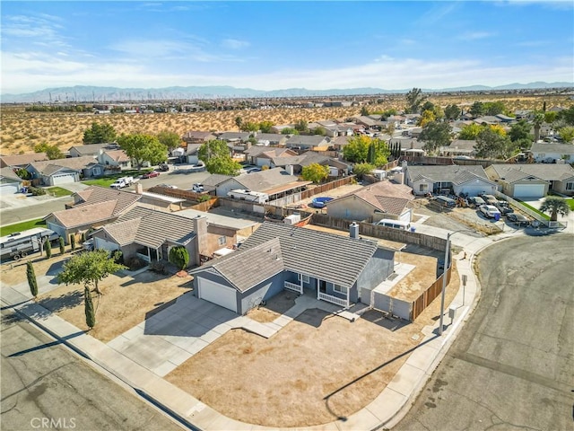 birds eye view of property with a mountain view