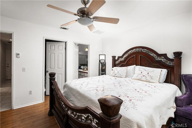 bedroom featuring ceiling fan, dark wood-type flooring, and connected bathroom