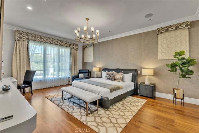 bedroom featuring hardwood / wood-style flooring, an inviting chandelier, and crown molding