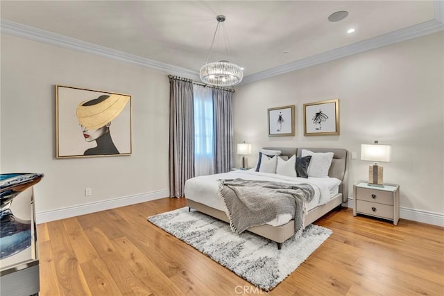 bedroom with an inviting chandelier, ornamental molding, and hardwood / wood-style flooring