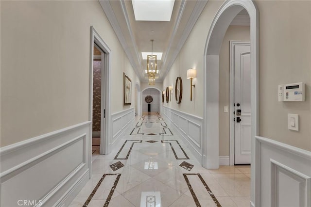 hallway featuring ornamental molding