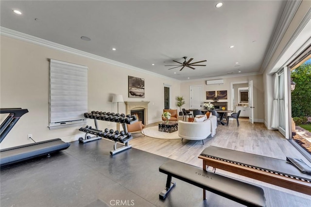 workout room featuring a wall mounted AC, wood-type flooring, ceiling fan, and ornamental molding