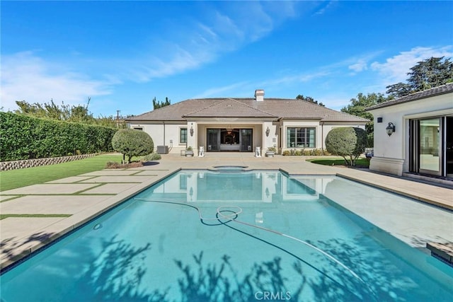 view of swimming pool with a patio