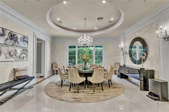 dining room with a raised ceiling, crown molding, and a notable chandelier