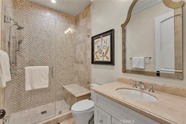 bathroom with tile patterned flooring, vanity, toilet, and a shower with shower door