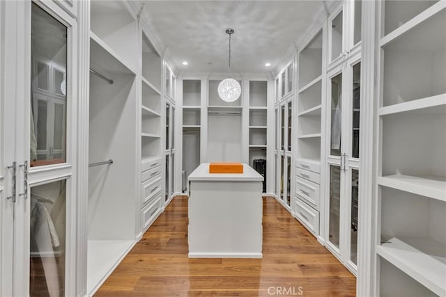 walk in closet featuring light hardwood / wood-style flooring