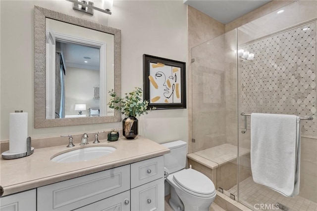 bathroom featuring walk in shower, crown molding, vanity, and toilet