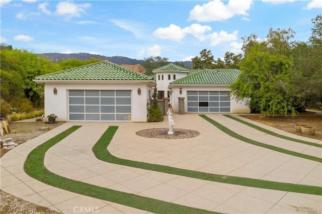 mediterranean / spanish house featuring a mountain view