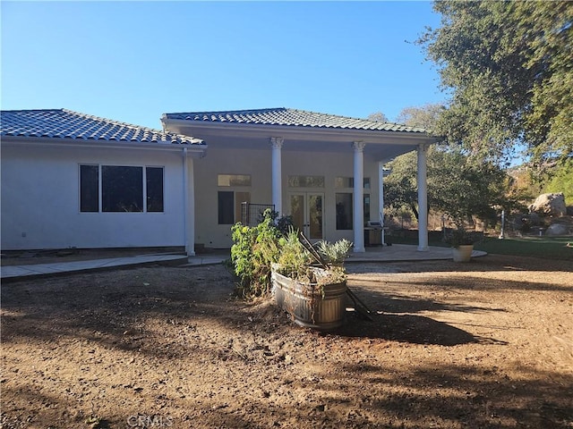 back of house with french doors