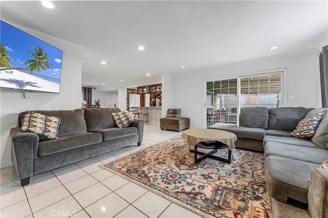 living room with light tile patterned floors and crown molding