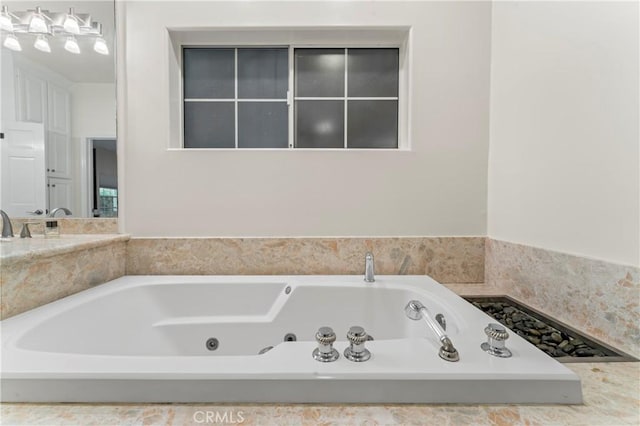 bathroom featuring a tub to relax in