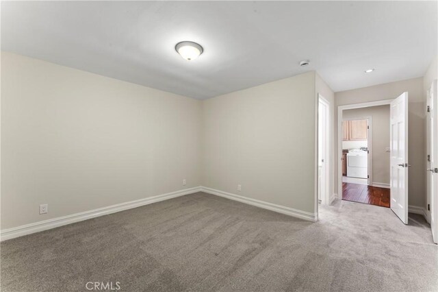 2355 N Beverly Glen Blvd, Los Angeles, CA 90077 - carpeted spare room with baseboards, washer / dryer, and a smoke detector
