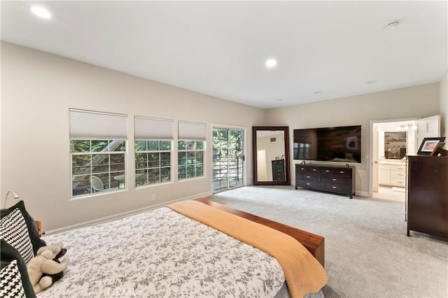 carpeted bedroom with connected bathroom