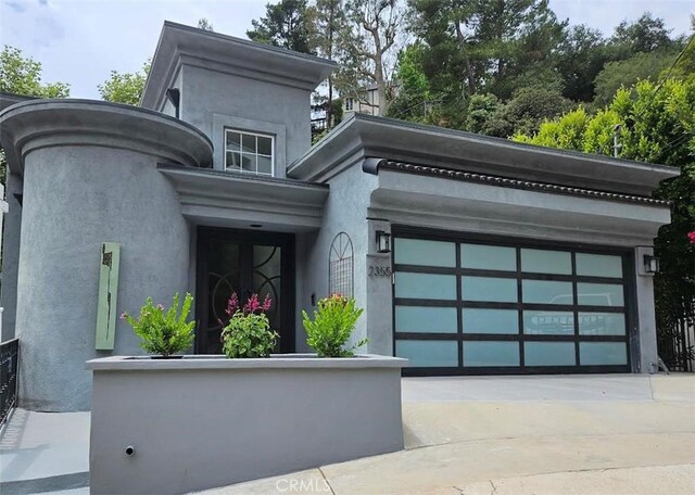 2355 N Beverly Glen Blvd, Los Angeles, CA 90077 - view of front of property featuring concrete driveway and stucco siding