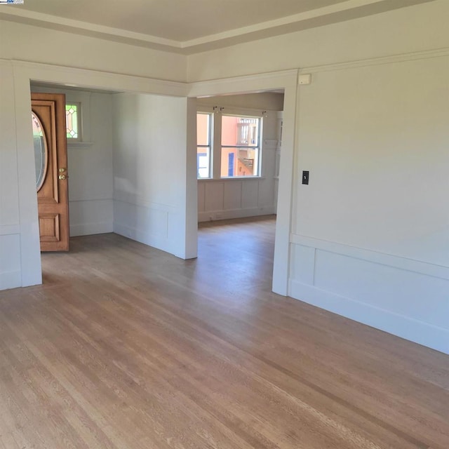 spare room with light wood-type flooring