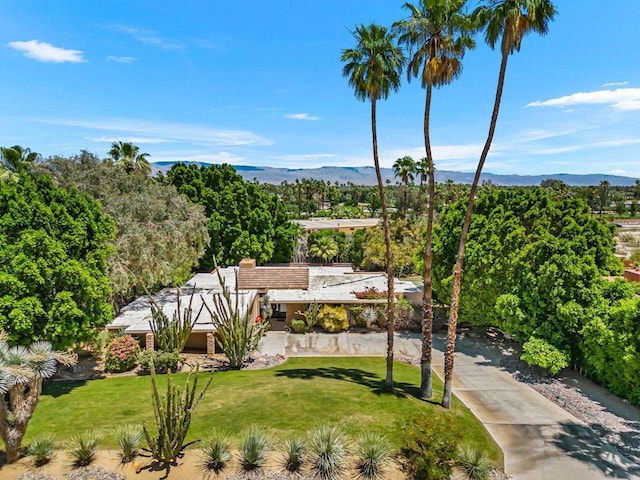 birds eye view of property featuring a mountain view