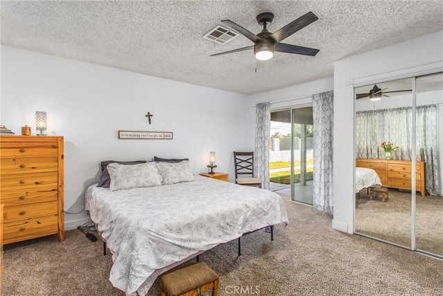 bedroom featuring a textured ceiling, ceiling fan, access to exterior, and carpet