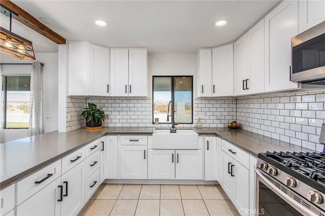 kitchen with white cabinets, sink, and stainless steel appliances