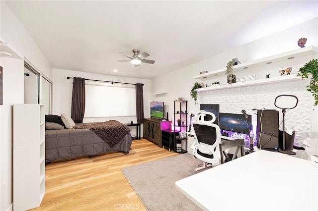 bedroom featuring hardwood / wood-style floors and ceiling fan