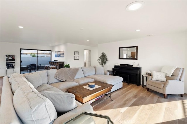 living room with light hardwood / wood-style flooring