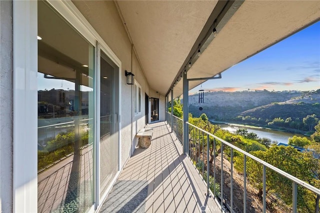 balcony featuring a water view