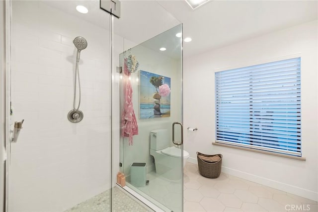 bathroom with an enclosed shower, toilet, and tile patterned floors