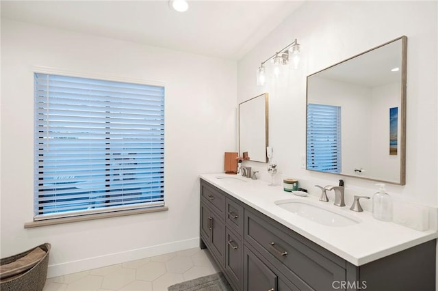 bathroom with tile patterned flooring and vanity