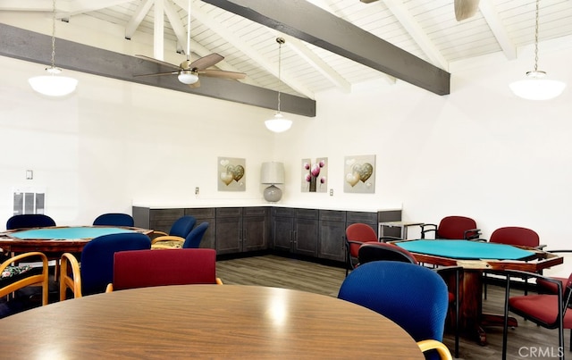 dining room featuring a ceiling fan, beam ceiling, high vaulted ceiling, and wood finished floors