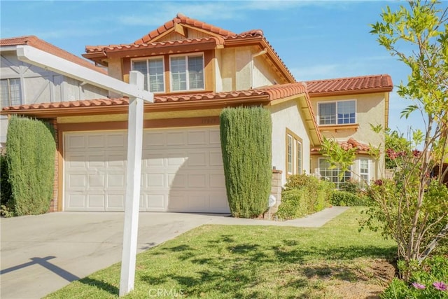 mediterranean / spanish-style home with a garage