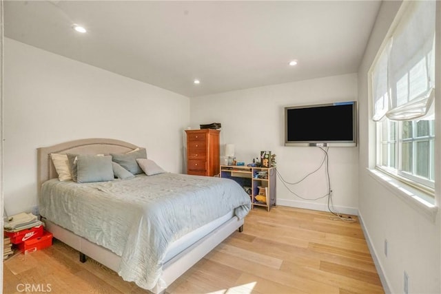 bedroom with light hardwood / wood-style flooring