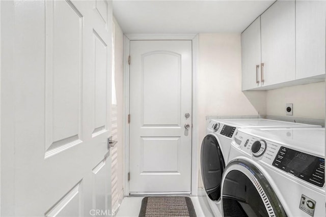 laundry room with cabinets and independent washer and dryer