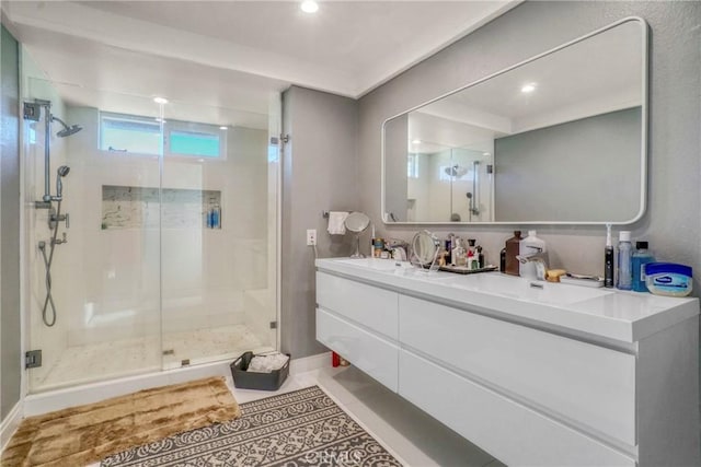 bathroom with vanity, tile patterned floors, and a shower with door