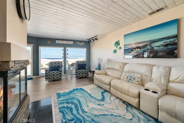 living room featuring wood-type flooring and wooden ceiling