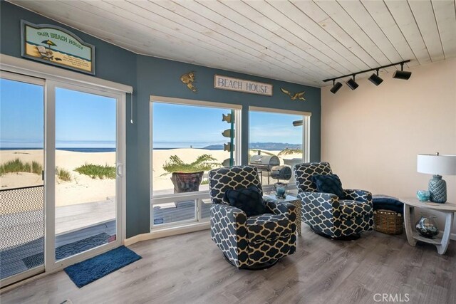 1652 Strand Way, Oceano, CA 93445 - sitting room with track lighting, wood ceiling, a water view, and wood finished floors