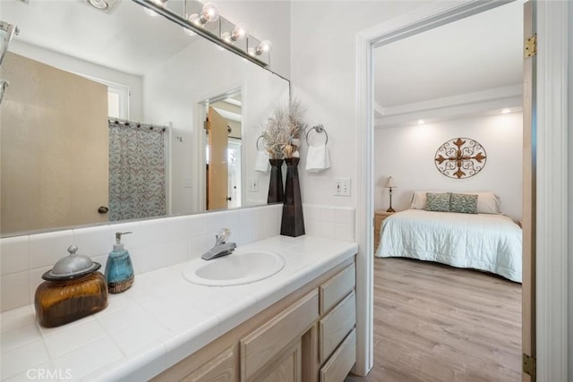 bathroom featuring wood-type flooring and vanity