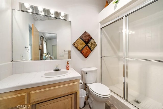 bathroom with toilet, vanity, vaulted ceiling, and walk in shower