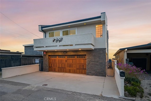 1652 Strand Way, Oceano, CA 93445 - contemporary home with a balcony, stone siding, a garage, stucco siding, and concrete driveway