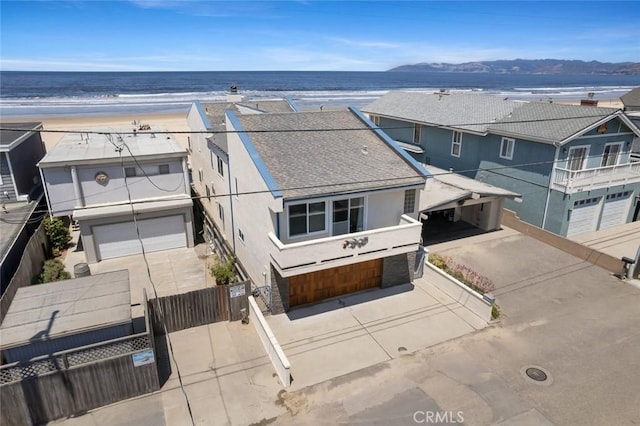 aerial view with a water view and a view of the beach