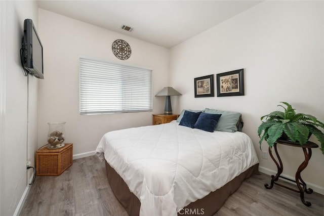 bedroom featuring light wood-type flooring