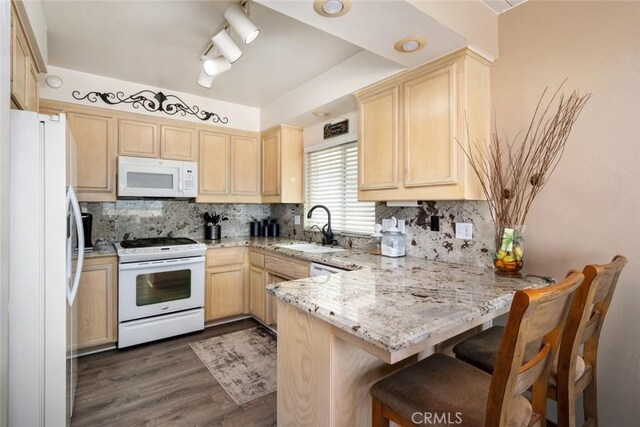 1652 Strand Way, Oceano, CA 93445 - kitchen with white appliances, a peninsula, light brown cabinets, dark wood-type flooring, and tasteful backsplash