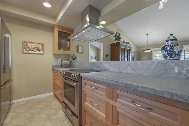 kitchen with appliances with stainless steel finishes, island range hood, vaulted ceiling, light tile patterned floors, and hanging light fixtures