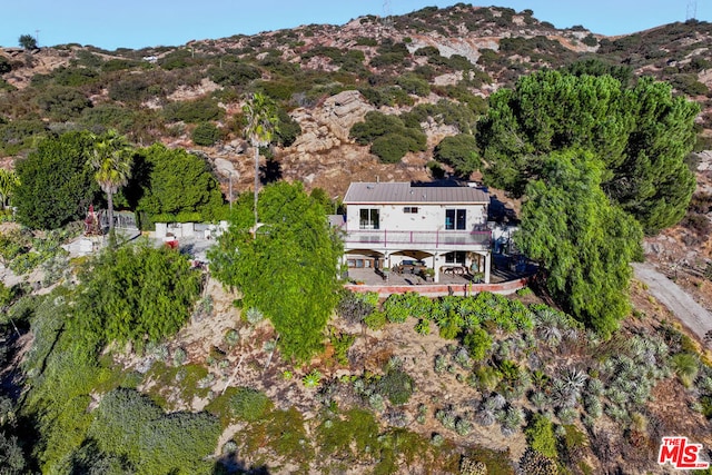 birds eye view of property with a mountain view