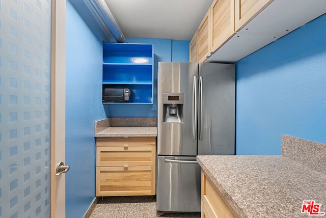 kitchen featuring light brown cabinets and stainless steel refrigerator with ice dispenser