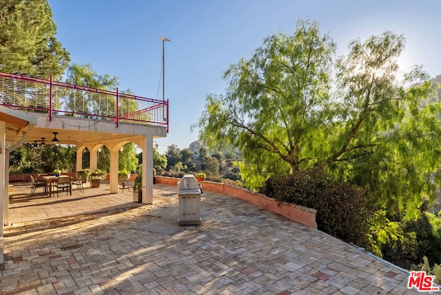 view of patio / terrace featuring ceiling fan