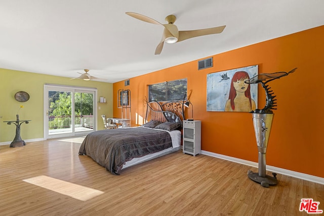 bedroom featuring ceiling fan, access to exterior, and light hardwood / wood-style flooring