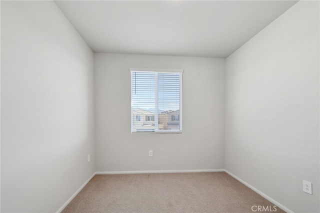 empty room featuring light carpet