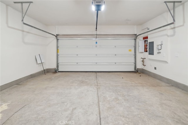 garage featuring a garage door opener and electric panel