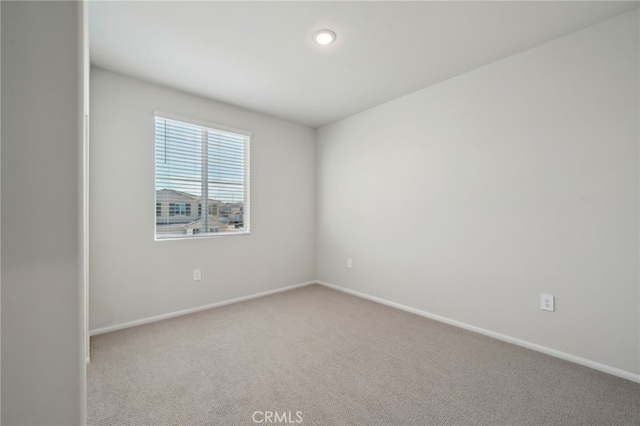 empty room featuring carpet flooring